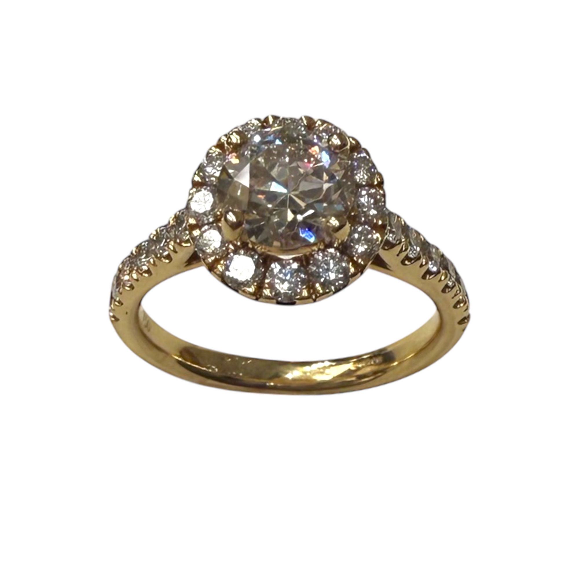 Diamond halo cluster engagement ring in yellow gold, the kind of piece traded across the Buying Centre counter