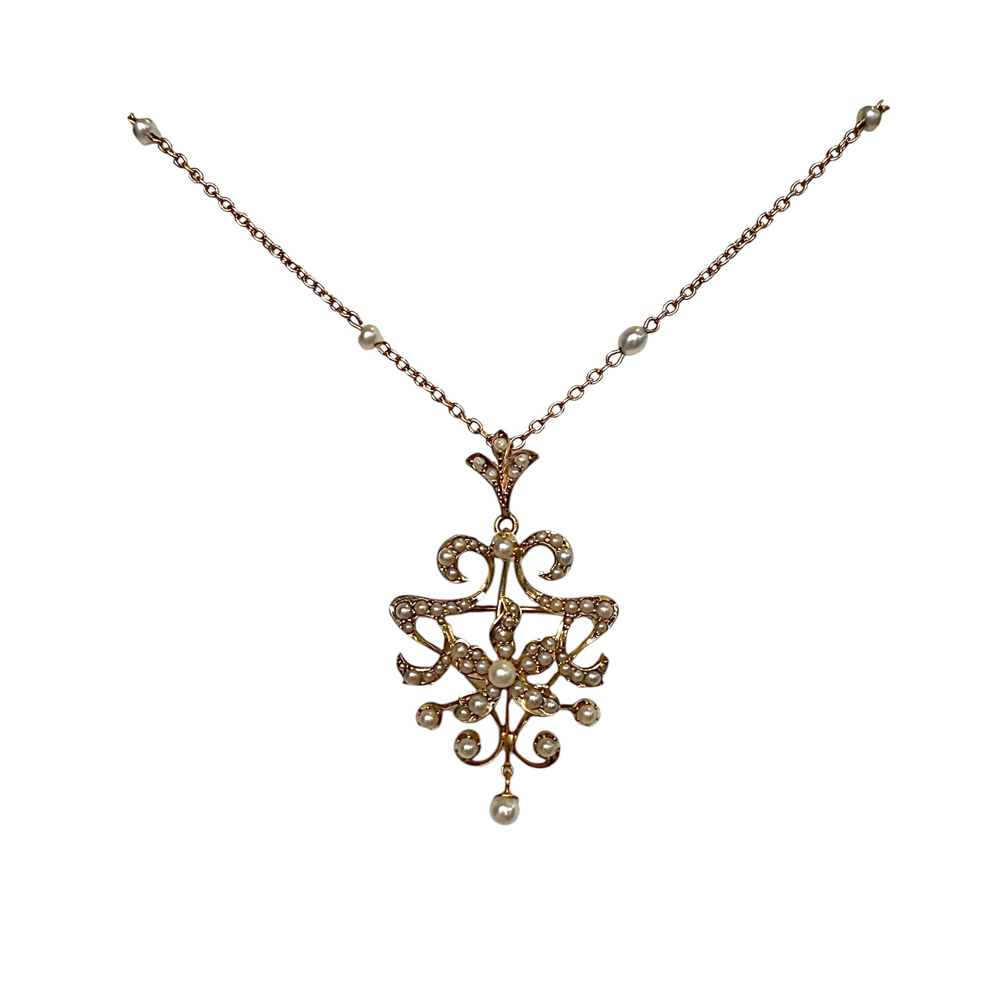 Edwardian seed-pearl and rose-gold pendant on its chain, from the Promenade Jewellers antique counter